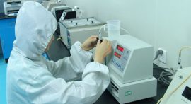 inspecting quality of syringe at laboratory
