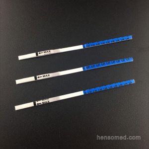three LH Ovulation Test Strips on black backgroud