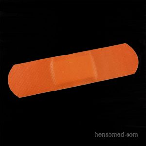 red cotton fabric adhesive bandage
